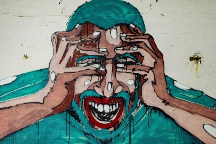 Ilustração que aparenta um homem em desespero, como se estivesse desmanchando